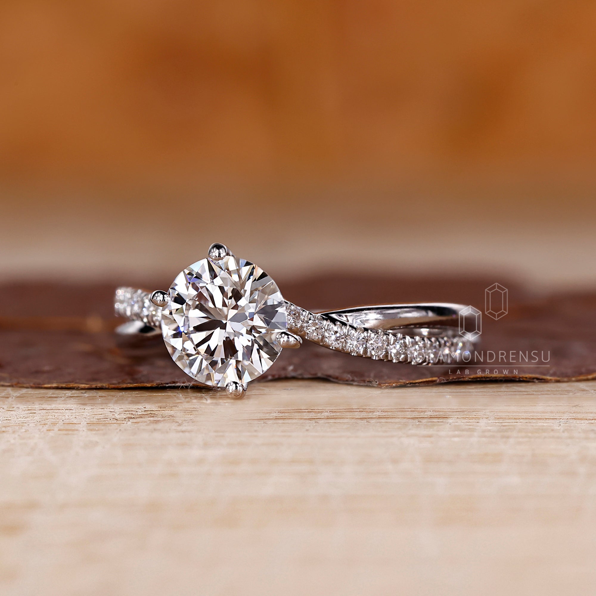 Four prong ring securing a sparkling diamond.
