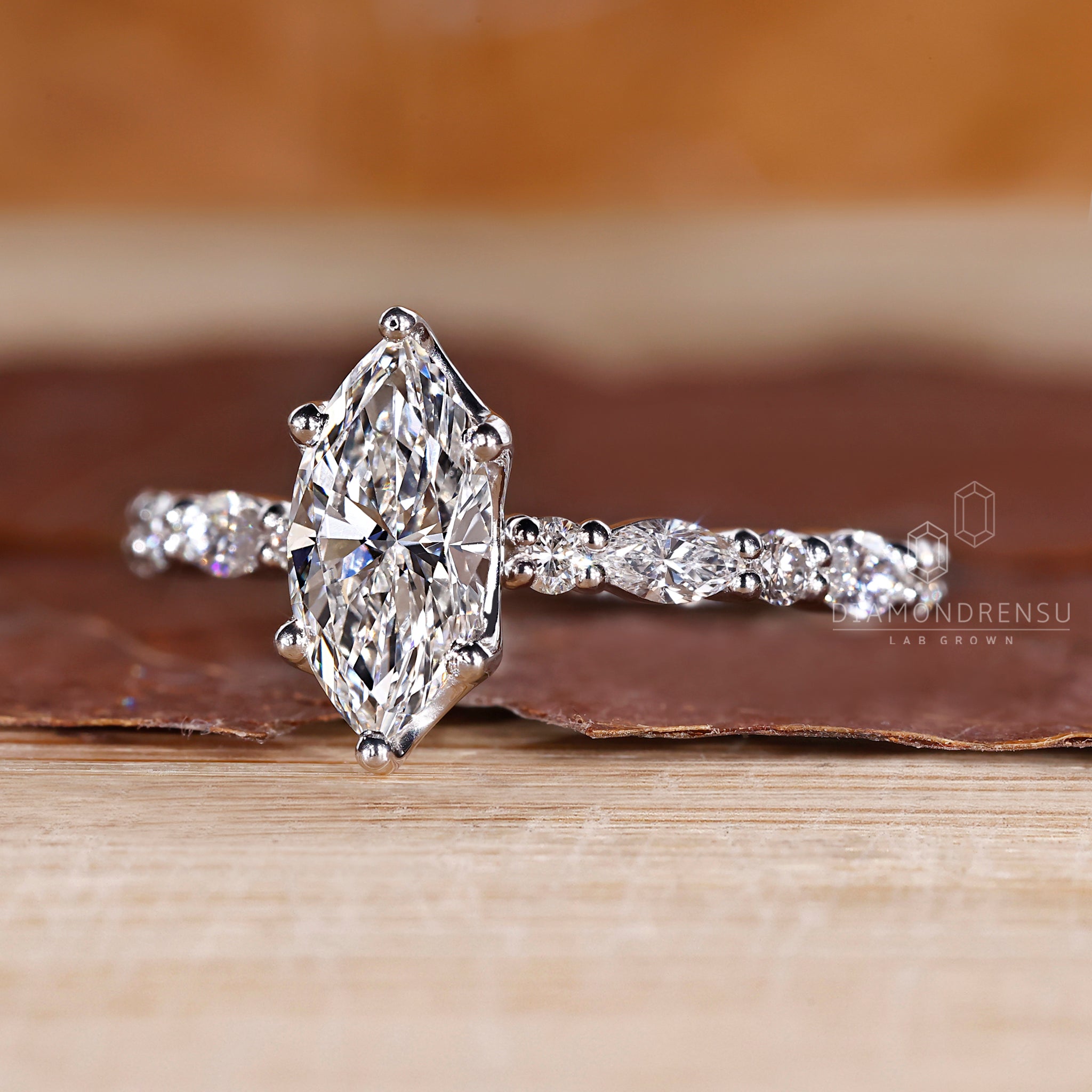 6 prong ring featuring lab grown marquise diamond.

