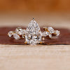 Pear shaped engagement ring in yellow gold.