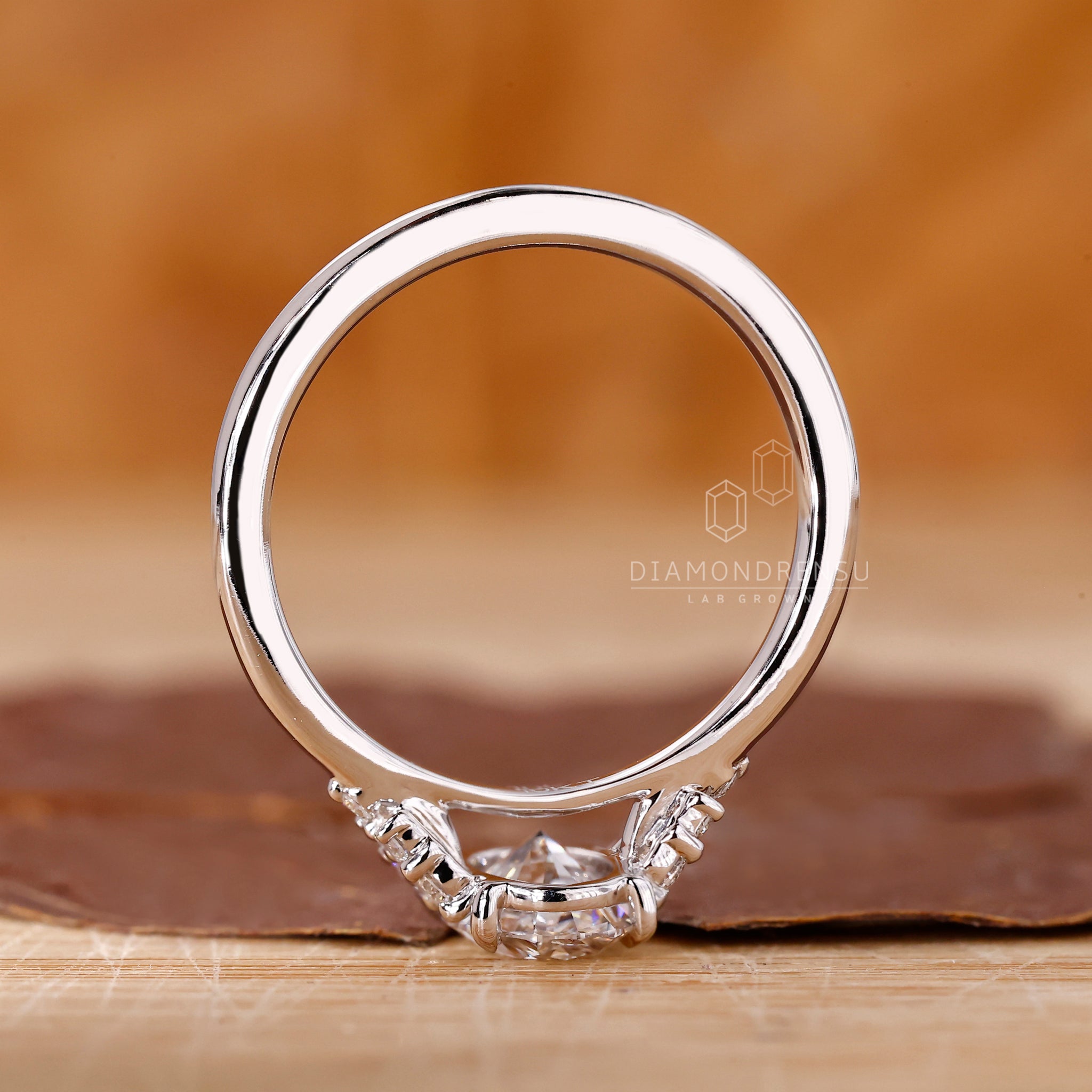 Diamond ring UK with oval and round diamonds