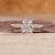 Cushion cut engagement ring includes cushion shape diamond.
