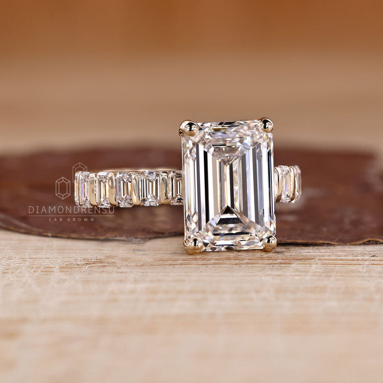 Handmade diamond ring with emerald cut centre stone.