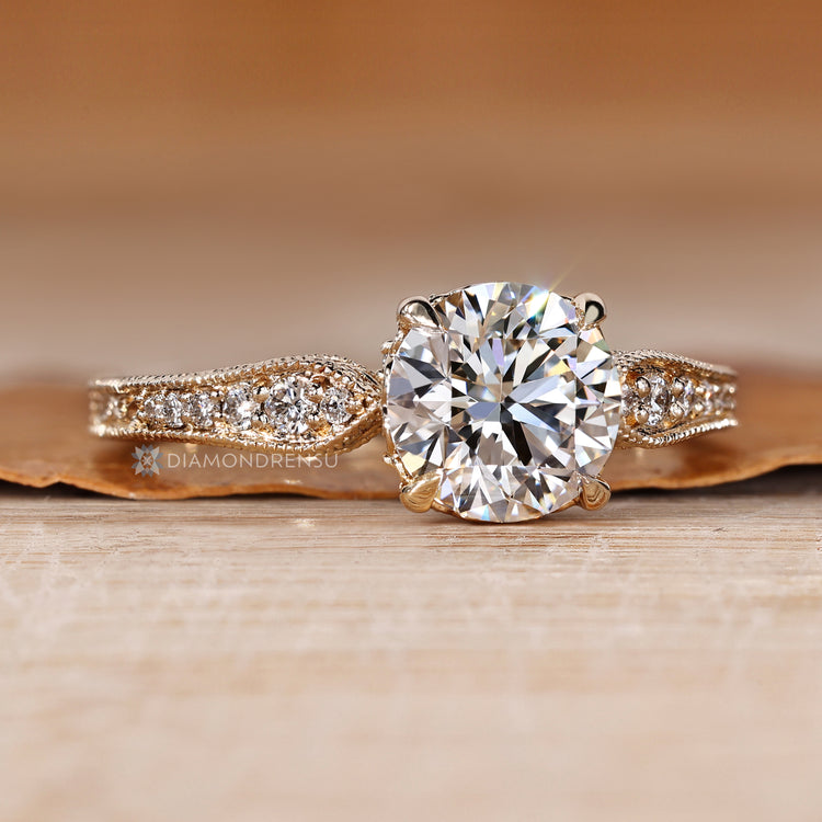 Lab grown diamond ring with four claw prong setting.