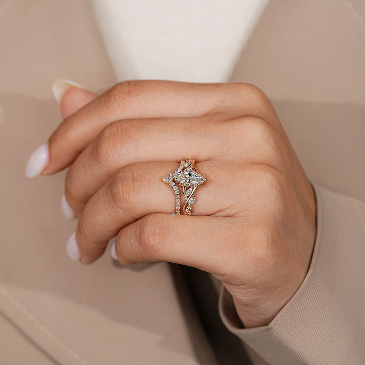 Marquise centre diamond with four claw prong setting.