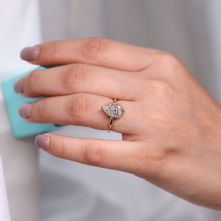 IGI certified pear diamond ring with six prong setting.
