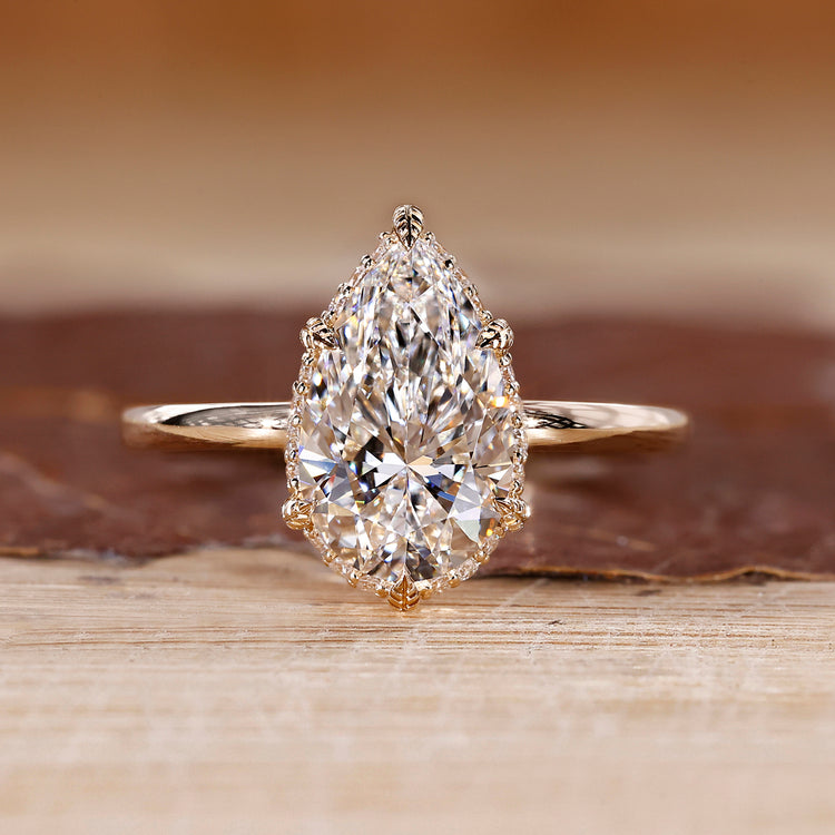 Pear cut lab grown diamond ring with side halo.