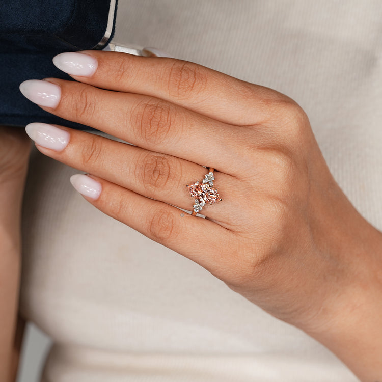 Pink centre diamond ring with muse setting.