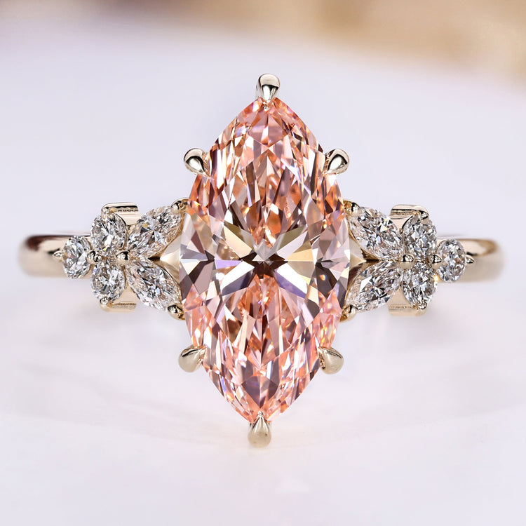 Marquise cut ring with pink centre diamond.
