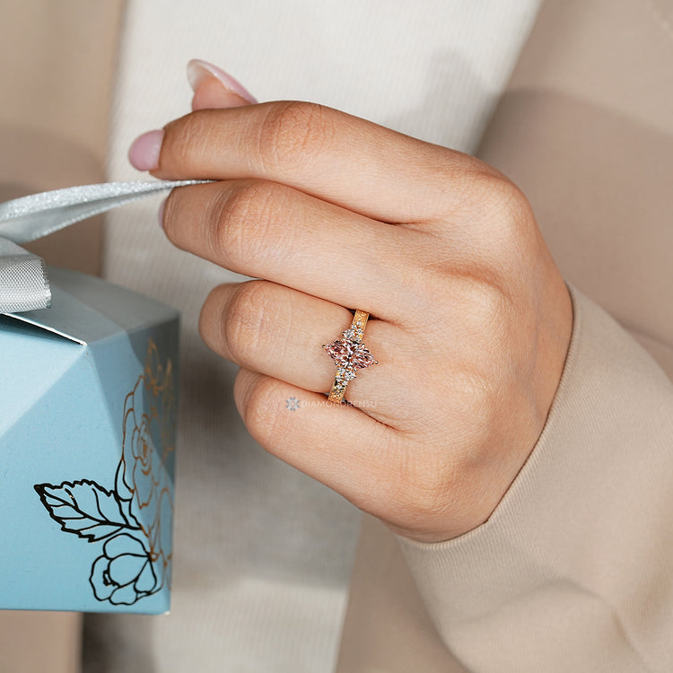 Art Deco diamond ring with pink centre stone.