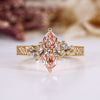 Marquise cut diamond ring with pink centre diamond.