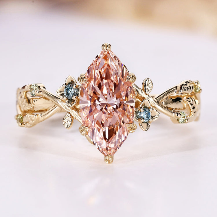 Marquise cut diamond ring with pink centre diamond.