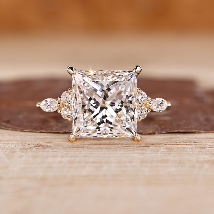 Princess cut engagement ring with marquise side stones.