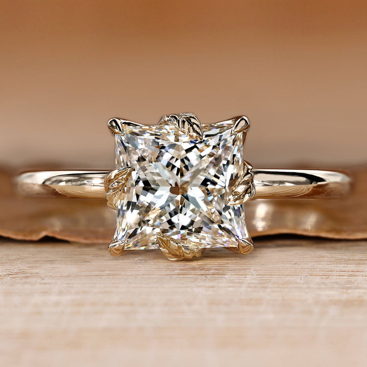 Princess cut diamond ring with tulip setting.