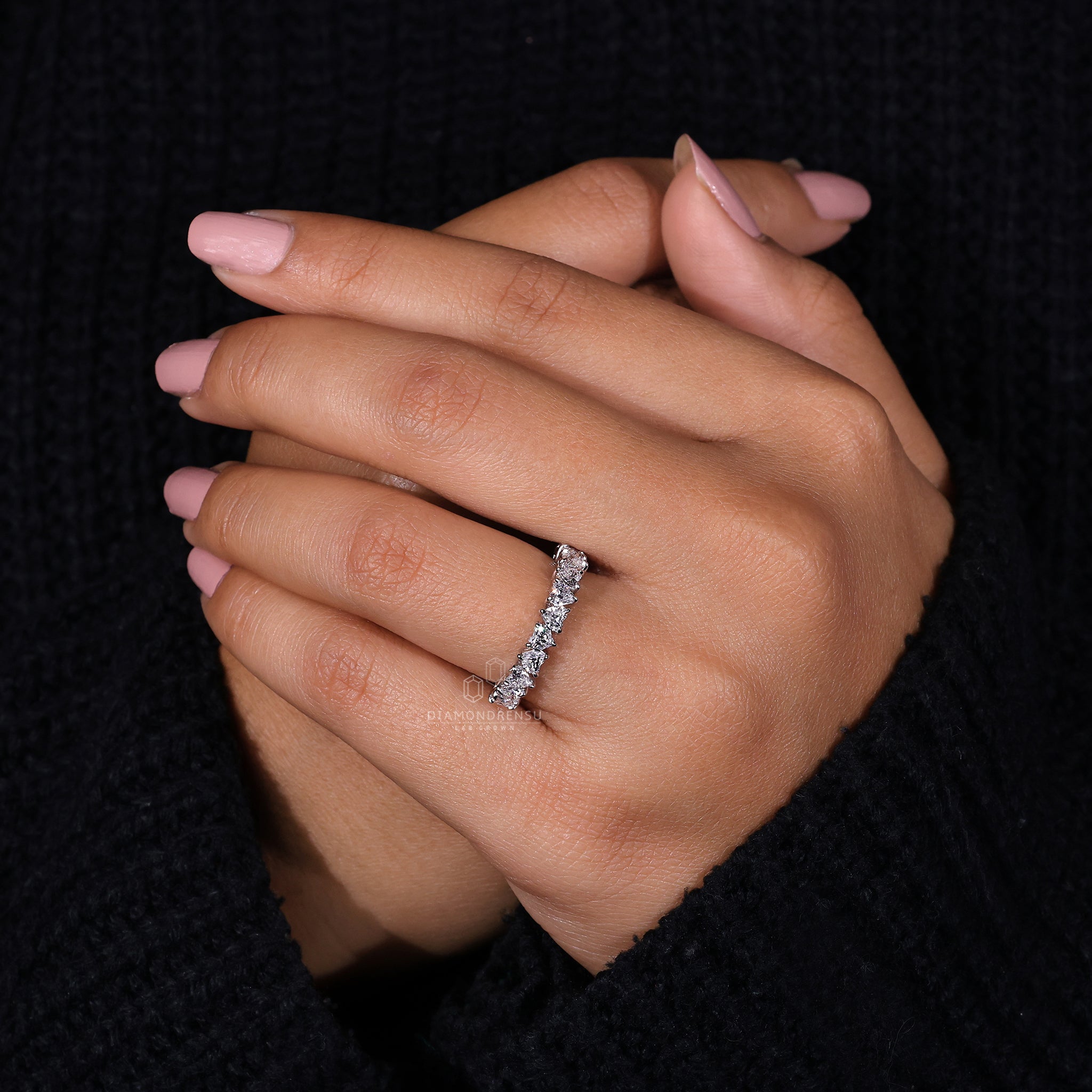 Half eternity wedding band with heart diamonds.
