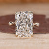 Radiant cut diamond ring with bamboo design band.