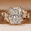 Radiant cut diamond ring with round side stones.