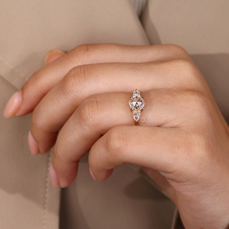 Three stone lab grown diamond ring with claw prongs.