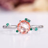 Peach sapphire engagement ring with round rose cut center.