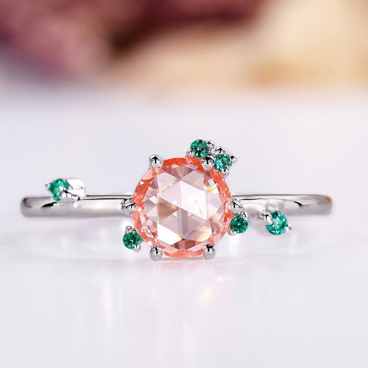 Peach sapphire engagement ring with round rose cut center.