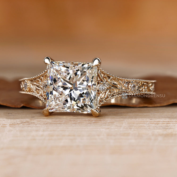 Lab grown diamond ring with round side stones.