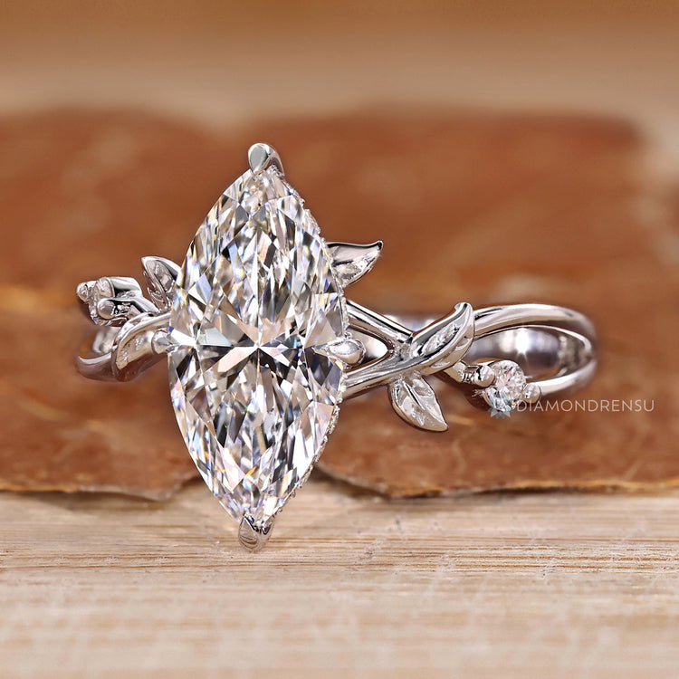 Nature inspired marquise diamond ring with twisted shank.