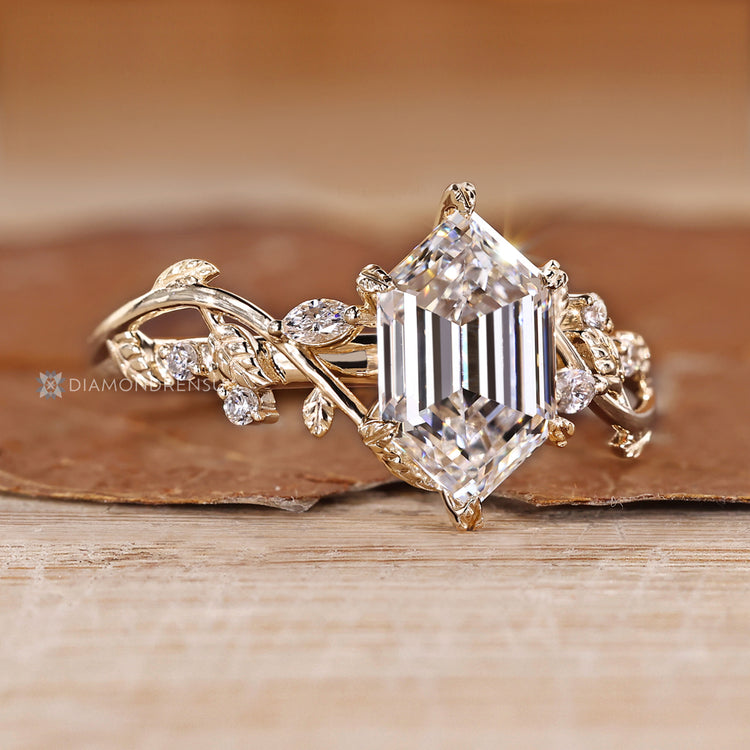 Lab grown hexagon diamond ring with leaf style prongs.