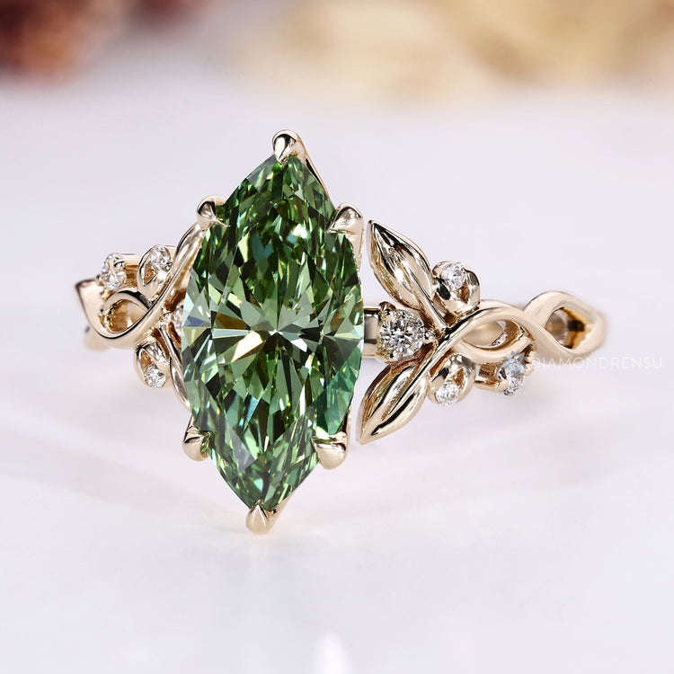 Marquise ring with vine motifs and branching details.