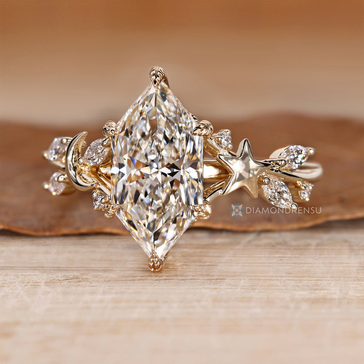 Dutch marquise ring with round diamond side stones.
