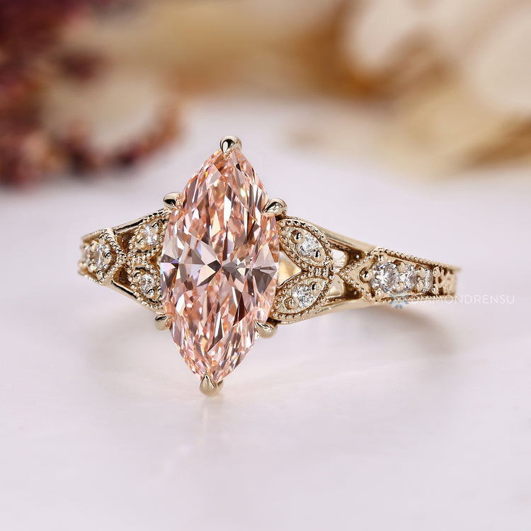 Pink marquise ring with six claw prong setting.