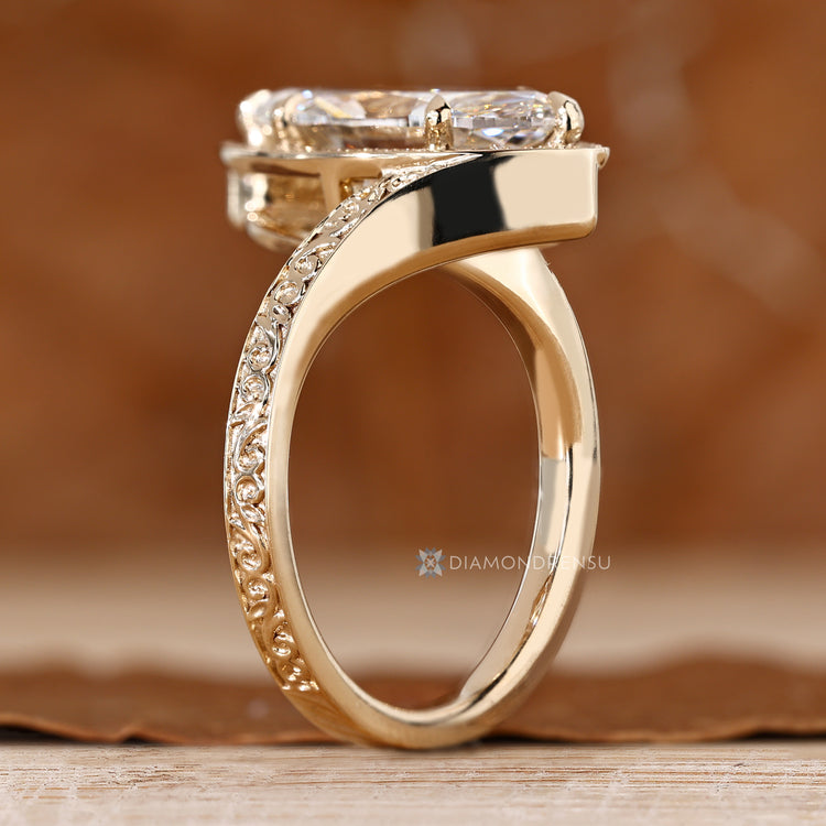 Handmade engagement ring with marquise diamond and round stones.