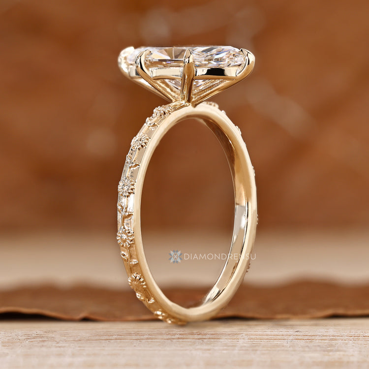 Marquise cut ring with six claw prong setting.