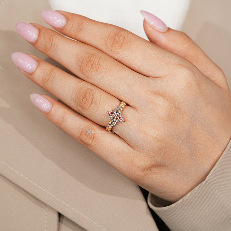 IGI certified pink diamond ring with six claw prongs.