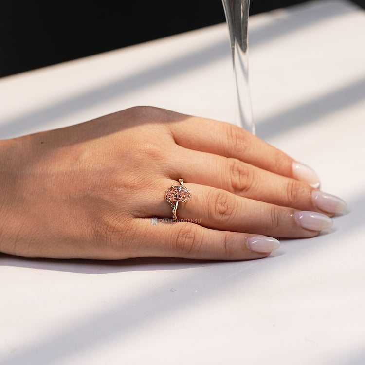 Handmade oval cut ring with tulip setting.