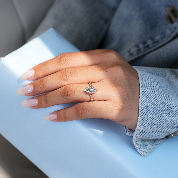 Marquise cut ring with vintage style and six claw prongs.