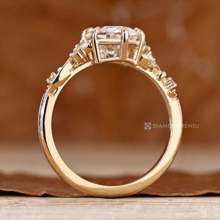 Six claw prong Dutch marquise ring with side stones.