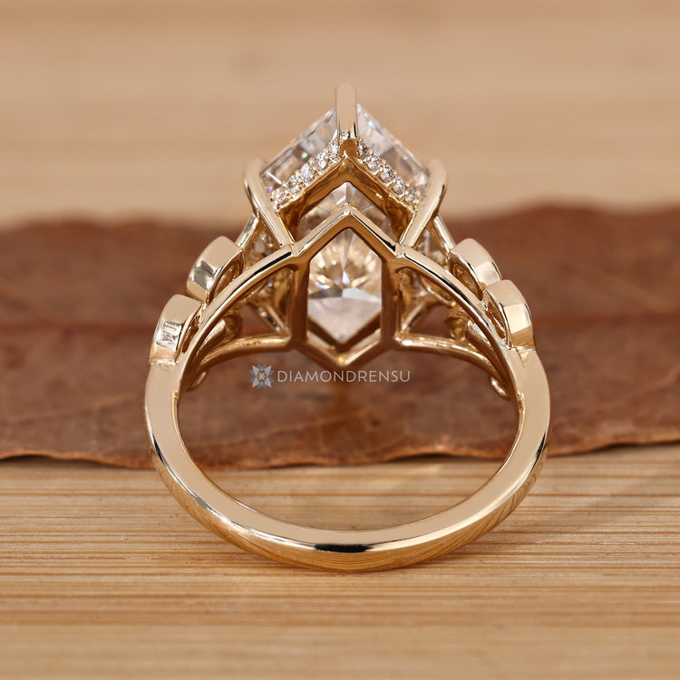 Handmade engagement ring with six claw prong setting.
