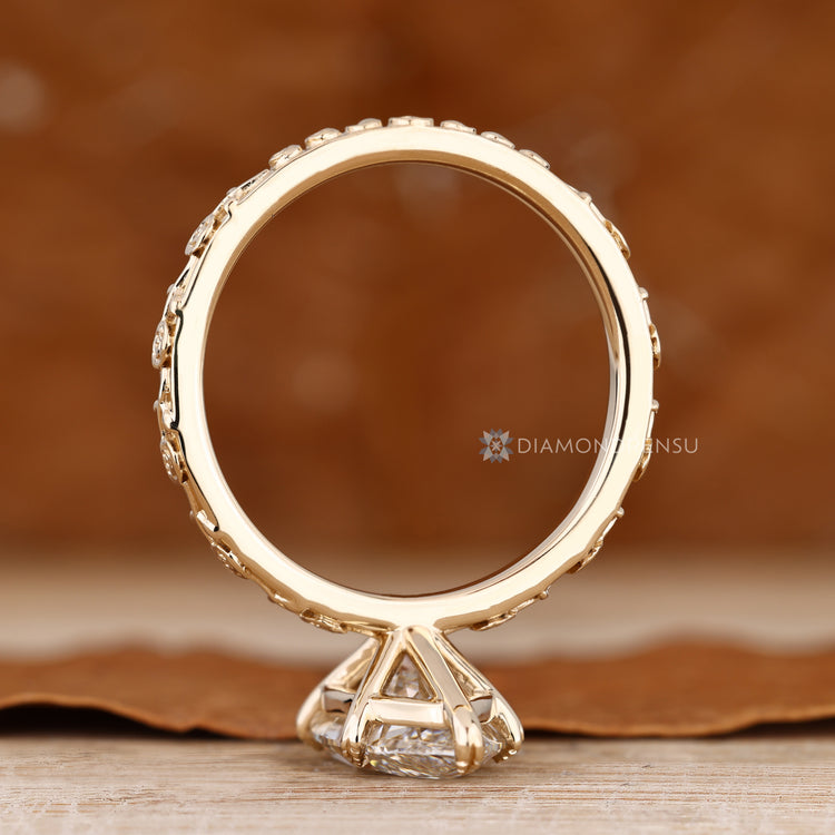 Art deco marquise engagement ring with six leaf prong setting.