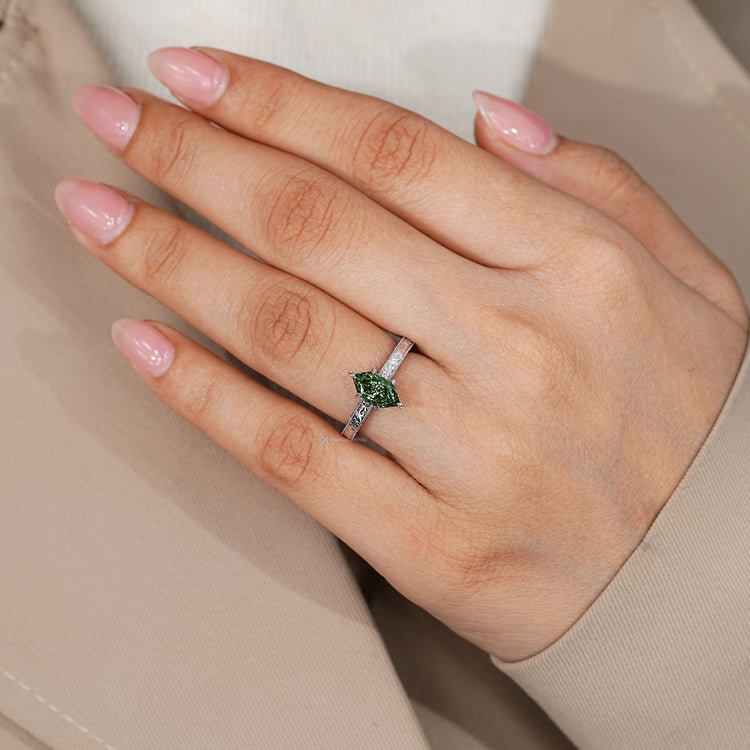 Dutch marquise ring with hidden bridge round diamond accent.