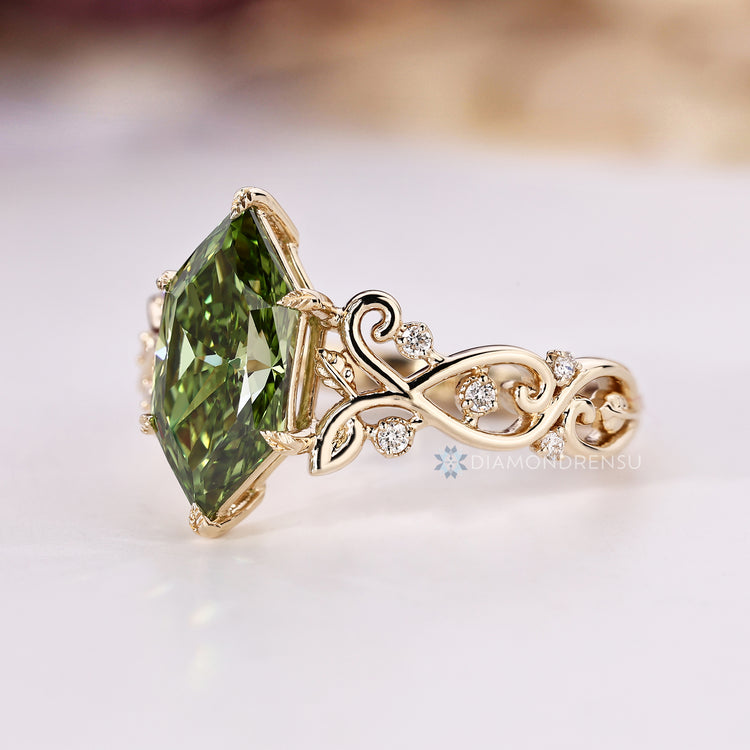 Green diamond engagement ring with twisted shank.