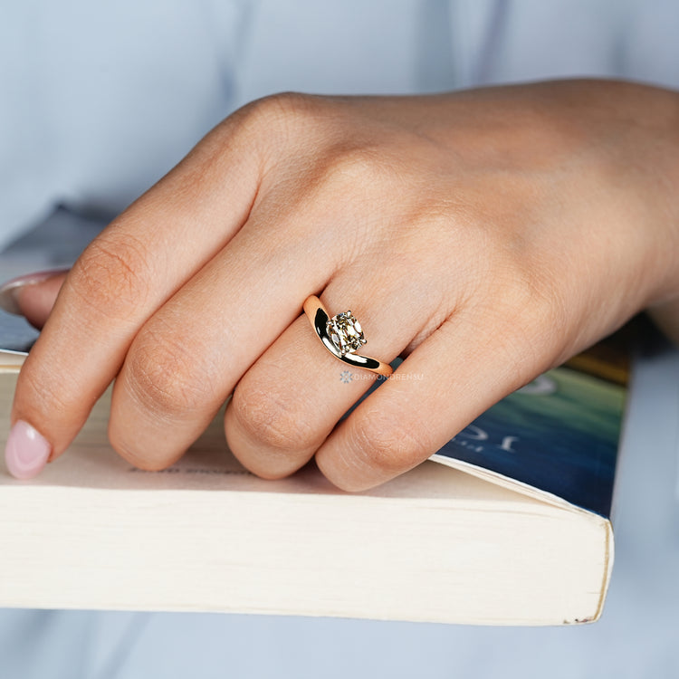 Handmade solitaire ring with tapered shank and four claw prongs.