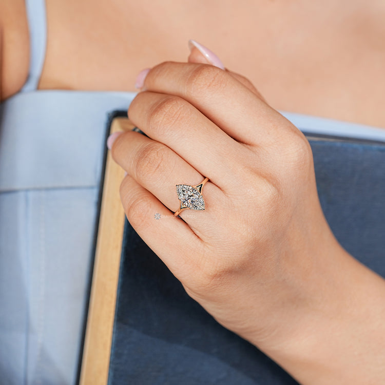 Handmade marquise diamond ring with milgrain details.