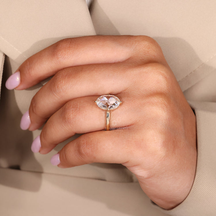 Handmade solitaire ring with compass claw prong.