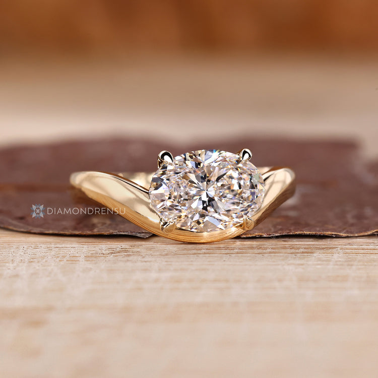 IGI certified oval diamond ring with four claw prongs.