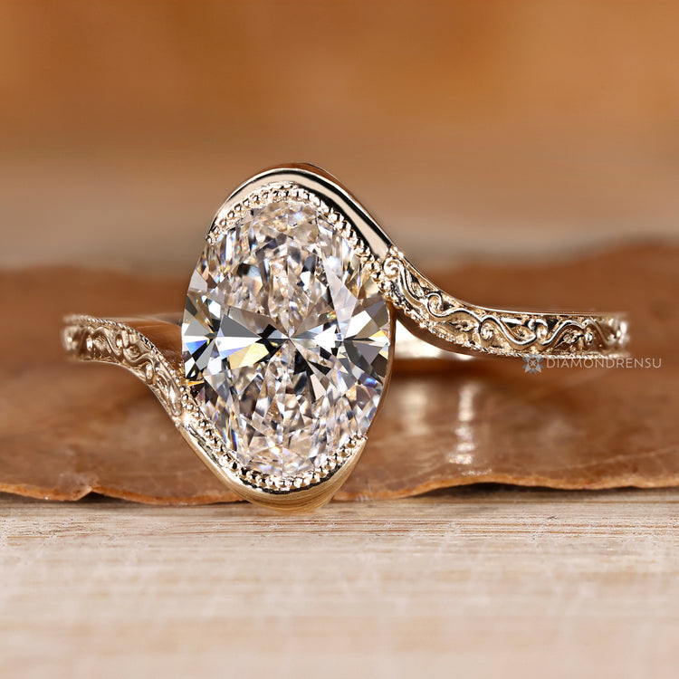 Oval diamond ring with Art Deco styling.