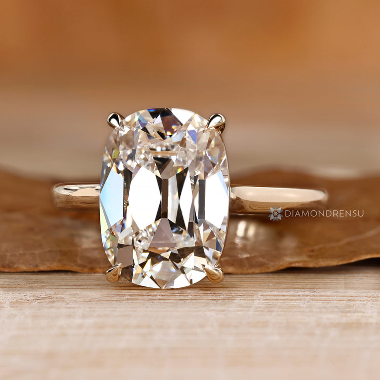 IGI certified cushion OMC diamond engagement ring.