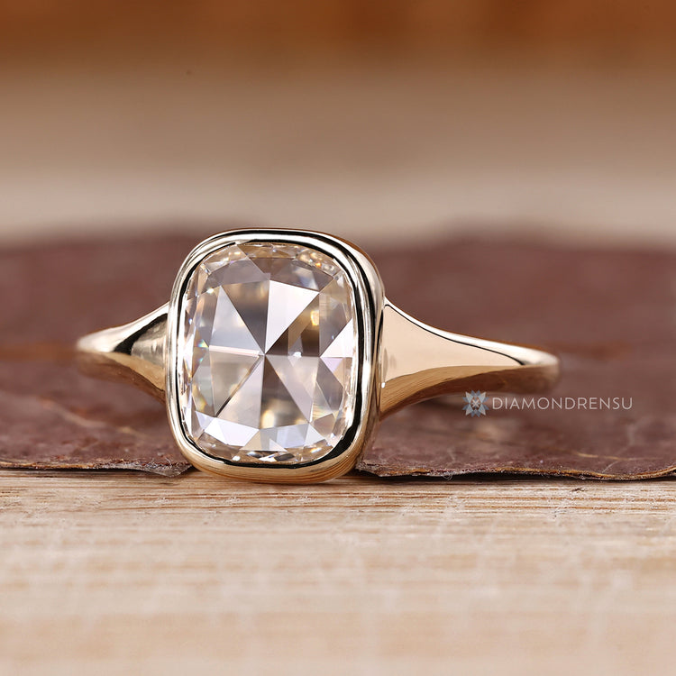 Cushion rose cut diamond ring with tapered shank.