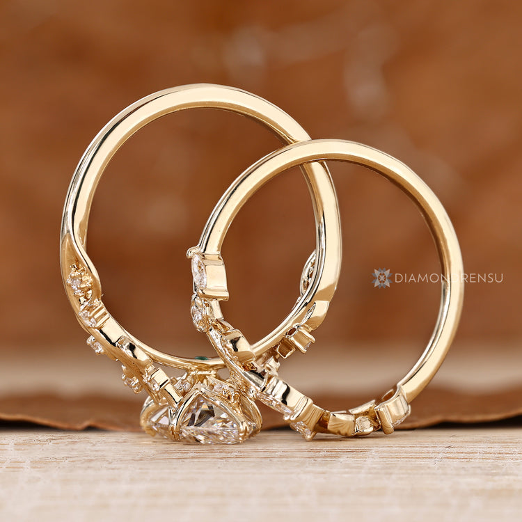 Marquise diamond ring with tulip setting and round accents.
