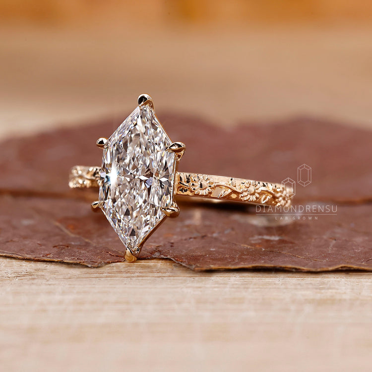 Dutch marquise ring with sunflower design on shank.
