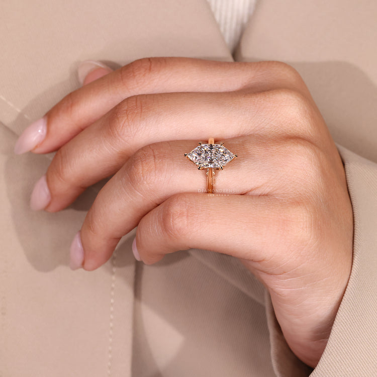 IGI marquise diamond ring with tapered band and prongs.