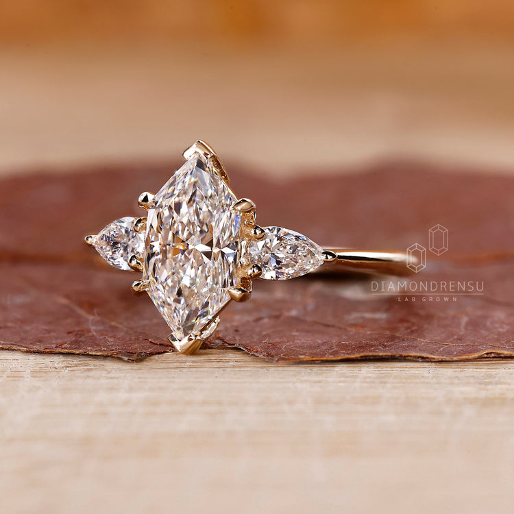 Three stone ring with dutch marquise and pear stones.